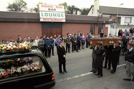The coffin of Steven Mullan being led past the Rising Sun Bar at Greysteel, Derry in 1993.