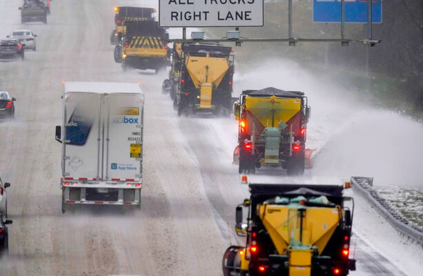 Tens of thousands without power as winter storm blasts US south-east