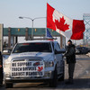 Police move in to clear anti-vaccine convoy protesters from key border bridge in Canada