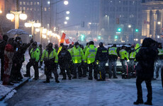 Canadian police arrest two leaders of protesting truckers