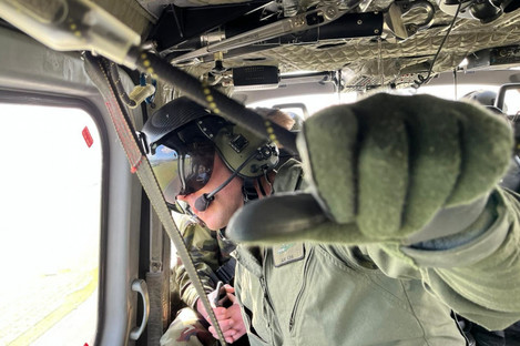 An Air Corps Airman monitoring helicopter movements during the operation.