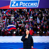 Vladimir Putin addresses rally in Moscow as Russian troops continue assault