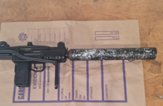 Submachine gun with silencer attached discovered during search of stolen jeep