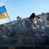 Ukraine says it has retaken Kyiv suburb and town, as Russia appears to switch focus to the east