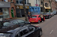 Man arrested following suspected acid attack outside Belfast shop