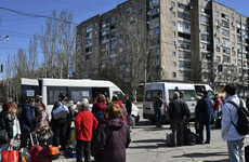 Prisoner exchange underway, and civilians flee eastern Ukraine town after train station attack