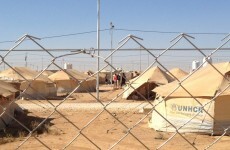Minister visits refugee camp in Jordan as Syrian rebels 'shoot down' helicopter in Damascus