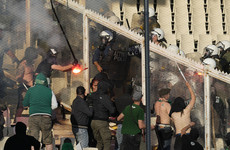 Fans fight with riot police as Panathinaikos win violence-marred Greek Cup final