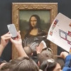 Man disguised as woman in a wheelchair arrested after smearing Mona Lisa with cake at Louvre