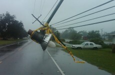 Isaac downgraded to tropical storm as curfew remains