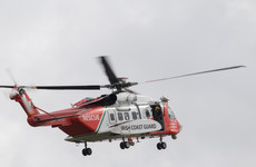 Emergency services including Coast Guard helicopter searching for missing climber in Kerry