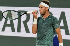 Casper Rudd reaches French Open final after protester ties herself to net