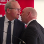 Two men arrested over security alert which halted Coveney speech in Belfast