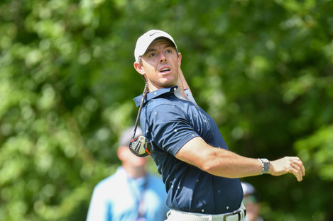 Rory McIlroy releases the club after an errant tee shot on the 12th hole during the second round of the Travelers Golf Championship.