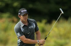 Golf: McIlroy leads, Oosthuizen and Woods chasing