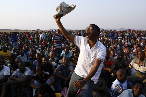 A mine worker sings and dances during a gathering at the Lonmin Platinum Mine near Rustenburg earlier this week.