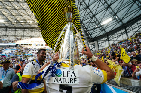 La Rochelle's Matthias Haddad celebrates with the Champions Cup trophy.