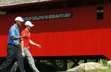 Neck and neck: Partners McIlroy and Woods in the hunt at BMW