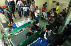 'Fans died in players' arms': At least 125 dead after stampede at Indonesian football stadium