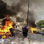 Iranian security forces take aim at protest buildings