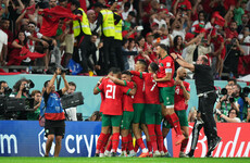 Morocco players celebrate with Palestinian flag after Spain upset