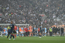 Melbourne Derby abandoned as goalkeeper struck in 'shocking' pitch invasion