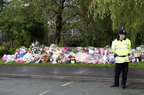 Floral tributes near to the scene where Pcs Fiona Bone and Nicola Hughes who were killed in Hattersley, Tameside on Tuesday.