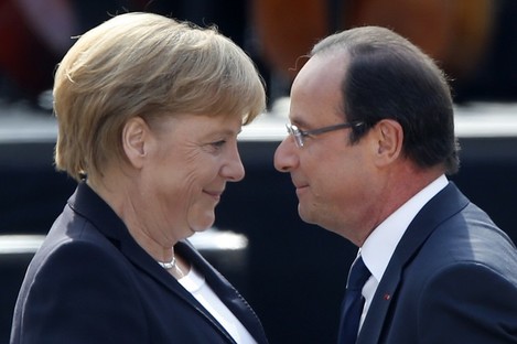 German Chancellor Angela Merkel and French President Francois Hollande greet each other in Ludwigsburg, Germany