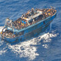 Greek police arrest nine suspected people smugglers over fatal capsizing of migrant boat