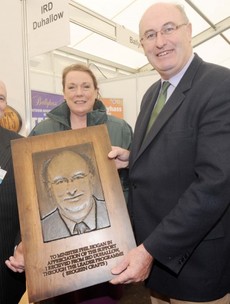 Minister Holding Portrait of Himself of the Day