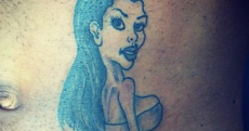 What is Kim Kardashian holding in this tattoo?