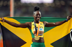Jackson retains women's 200m world title with stunning run