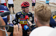 Defending Vuelta champ Evenepoel surrenders red jersey to Martinez