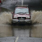 In pictures: Children carried from school during evacuation as floods hit south-east