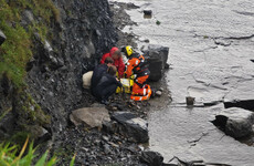 Woman and dog airlifted to safety after being cut off by rising tide