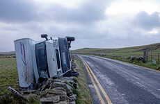 Campervan blown through a stone wall in high winds in Co Clare