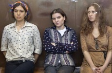 Russia frees one Pussy Riot member, keeps two in jail