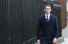 Why is Enoch Burke still receiving his full teacher's salary?