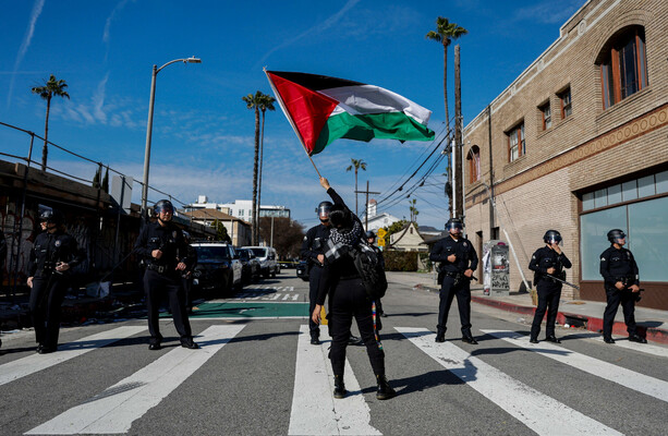 Oscars ceremony delayed by Gaza protest as stars wear red pins ...