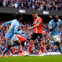 Five-star Manchester City cruise past Luton to go top of Premier League table