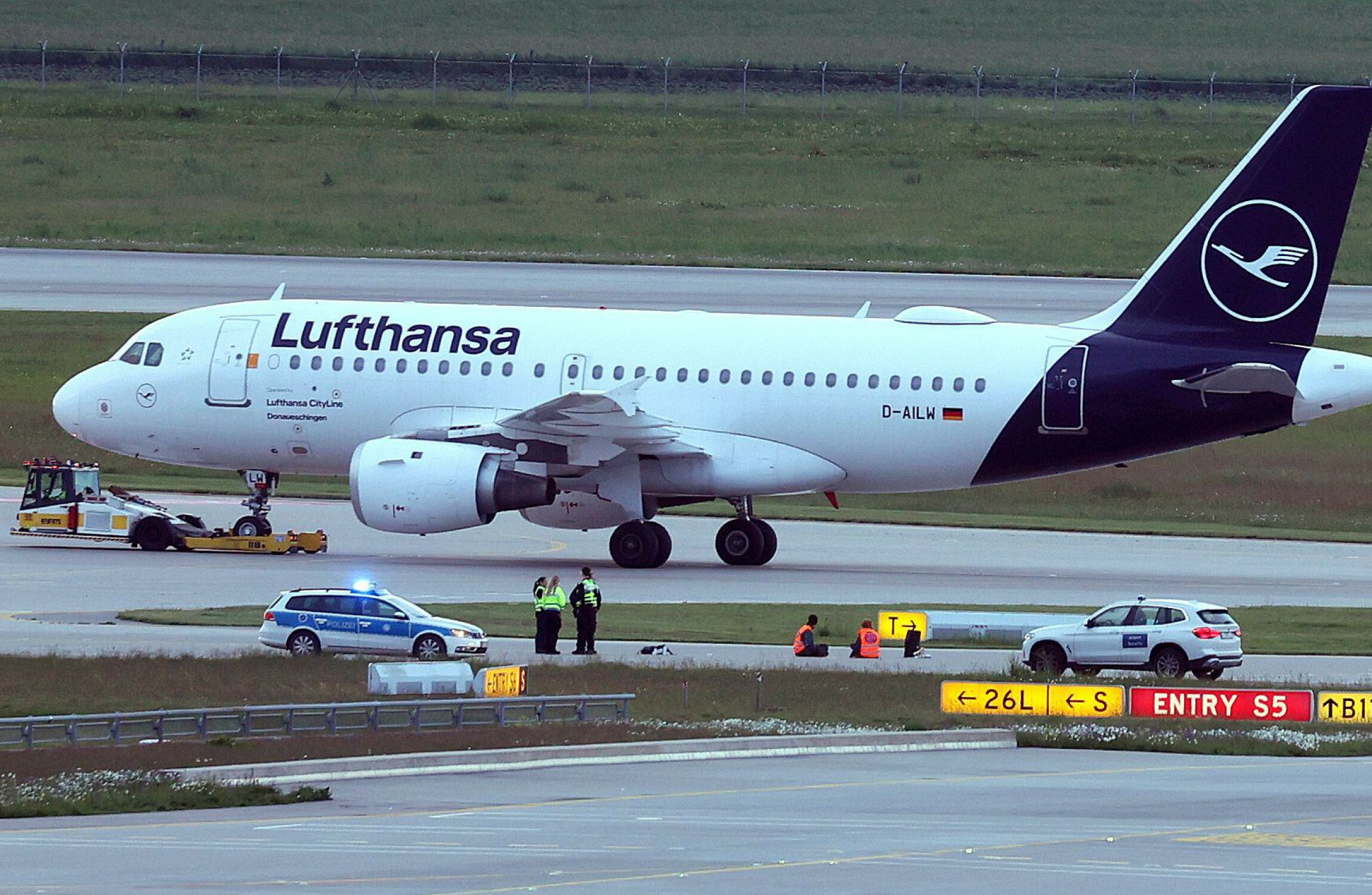 Climate protesters cause temporary closure of Munich Airport after gluing themselves to taxiways - Vimarsana News