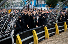 Thousands of mourners of Iranian president Ebrahim Raisi gather for funerary procession