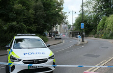Police in London arrest man in connection with discovery of remains in two suitcases yesterday