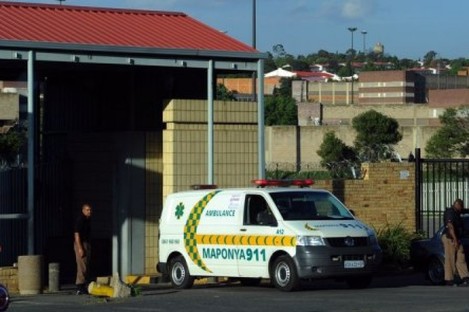 An ambulance leaves Johannesburg's central prison after an explosion near the prison.