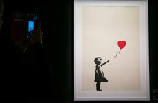 Two charged with burglary after Banksy painting stolen from London gallery
