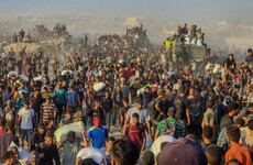 Israeli troops kill 11 Palestinians waiting for food, with 19 killed in strikes, Gaza's civil defence says