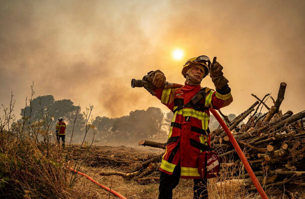 Firefighters battle blaze in France amid fears that dry weather could ignite new flames