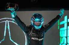 McLaren duo collide on opening lap before George Russell wins Singapore GP