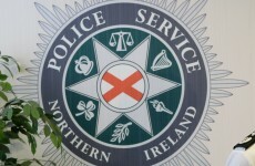 Three arrested before Clinton visit charged with terrorism offences