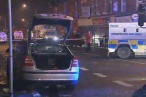 The police car which was petrol-bombed last night with a PSNI officer inside